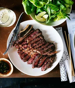 Wood-fired rib-eye with jaew, butter lettuce and Asian herbs