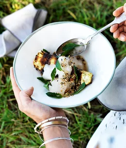 Charred pineapple with lemon and ginger granita, cashew praline and Thai basil