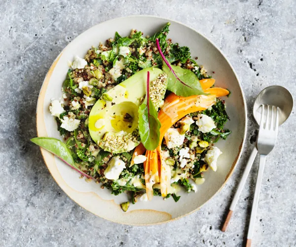 Avocado bowl with quinoa, kale and tahini lemon dressing