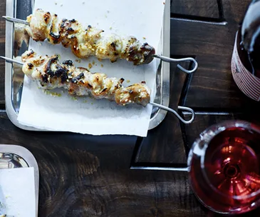 Grilled chicken sticks in chicken fat and sesame