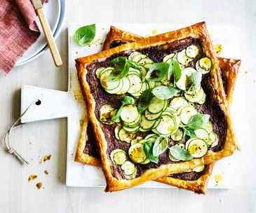Zucchini, black olive and goat's cheese tarts