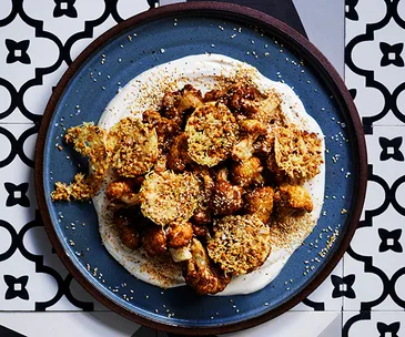 Fried cauliflower with parmesan wafers and tahini yoghurt