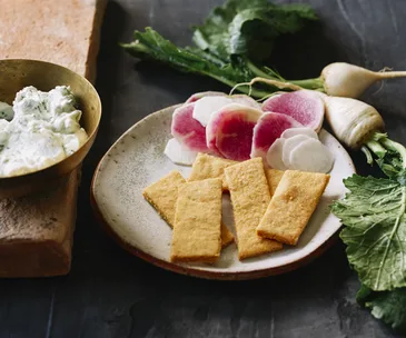 Radishes and turnips with yoghurt dip and cornmeal crackers