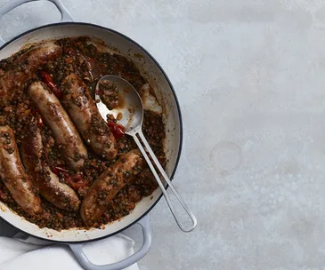 Braised pork and fennel sausages with lentils and rosemary