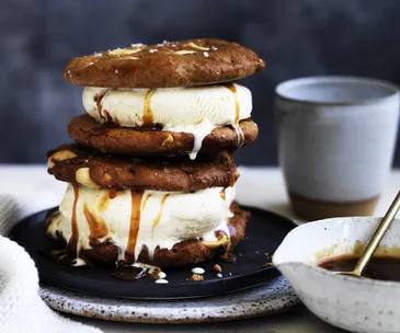 Warm peanut butter cookie ice-cream sandwiches with burnt honey