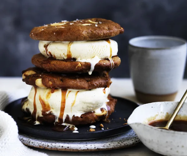 Warm peanut butter cookie ice-cream sandwiches with burnt honey