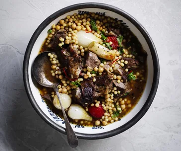 Baharat lamb shoulder with onions and moghrabieh