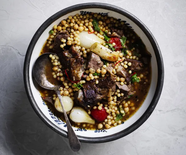 Baharat lamb shoulder with onions and moghrabieh