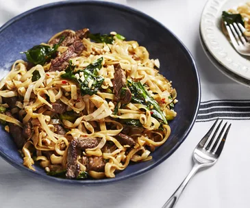Stir-fried beef and gai lan with rice noodles