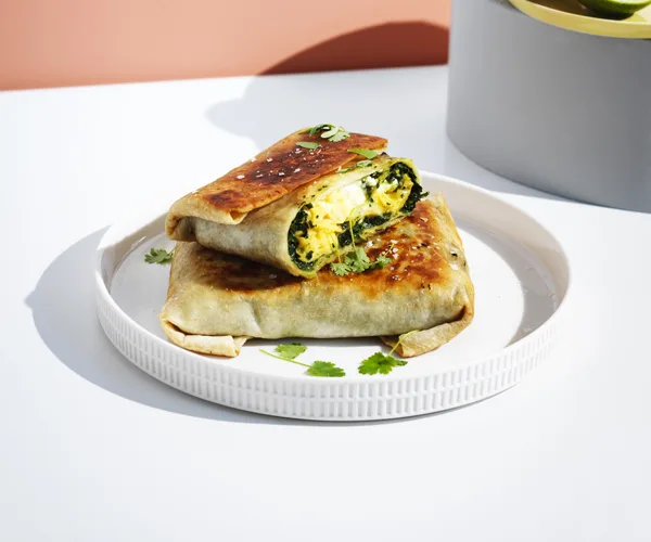 Egg and Indian-spiced creamed silverbeet wraps