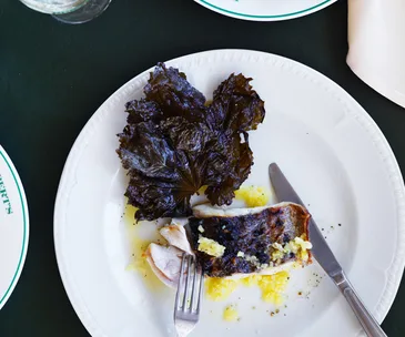 Grilled hapuku with preserved lemon and vine leaves