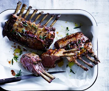 Slow-roasted lamb rack with white beans and black garlic aïoli