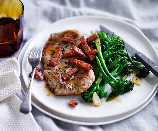 Pork schnitzel with broccolini and sopressa