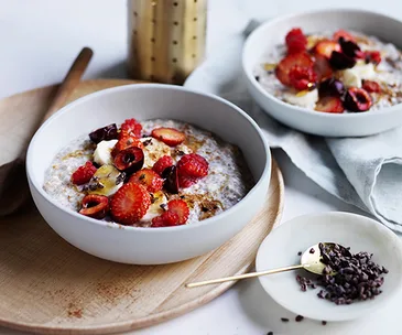 Almond milk Bircher muesli with banana, berries and cacao nibs