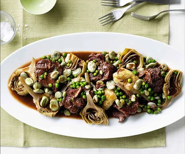 Lamb neck with artichokes, broad beans and peas