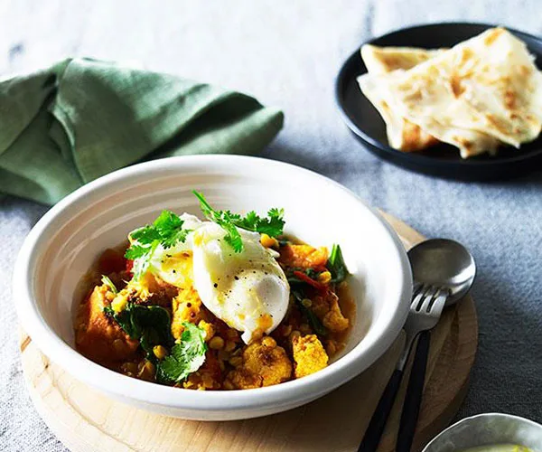 Breakfast curry with roti and poached egg