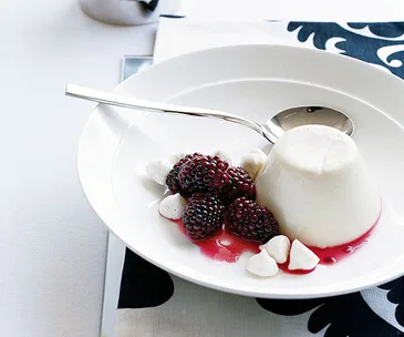 Almond milk panna cotta with macerated blackberries and almond meringues