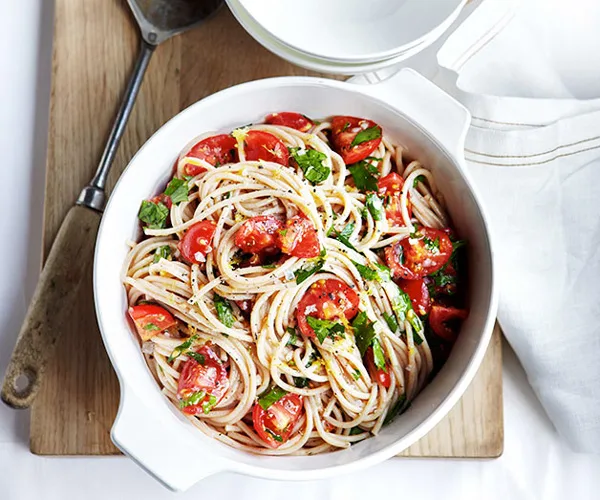 Buckwheat spaghetti with tomato, lemon and flat-leaf parsley