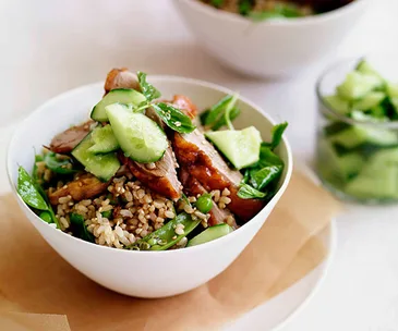 Chinese roast duck with brown rice, peas and cucumber