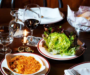 L-R Restaurant Hubert's kimchi gratin & red butter lettuce with caper and anchovy vinaigrette