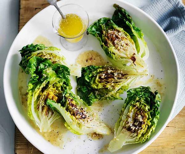 Grilled cos with lemon-anchovy butter dressing