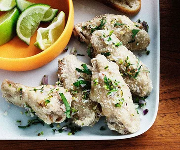 Fried chicken wings with coriander and green chilli