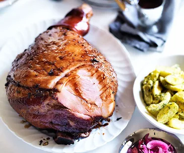 Cola-glazed ham, creamy potato and egg salad, and pickled onion