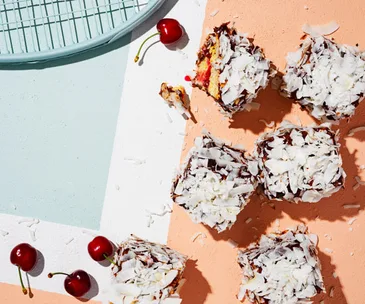 Coconut lamingtons with cherry jam