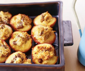 Baked nectarines stuffed with coconut and milk chocolate