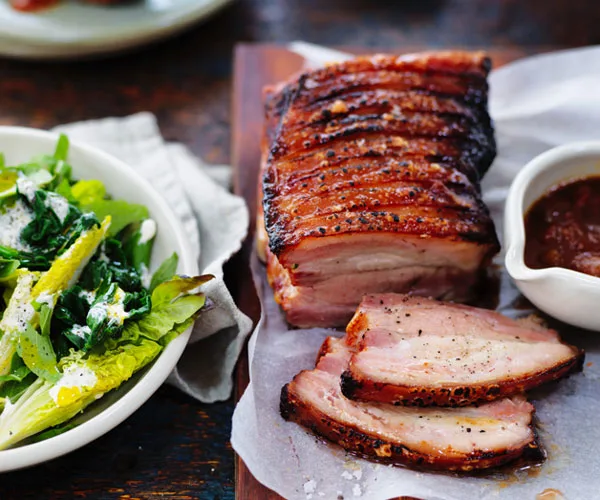 Roasted pork belly with tomato and cucumber relish