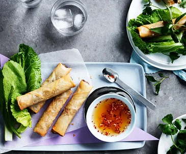 Vietnamese spring rolls with mustard leaves and herbs