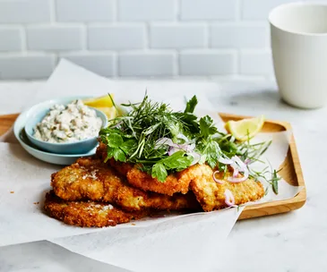 Veal schnitzel with tuna sauce and herb salad