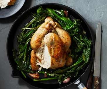 Roast chicken with anchovy butter and greens