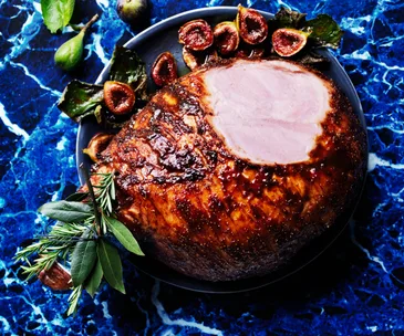 Whole glazed ham with roasted figs