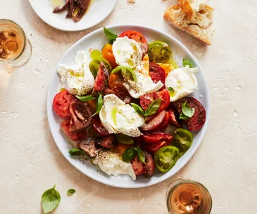 Insalata of tomato, mozzarella and basil with anchovies