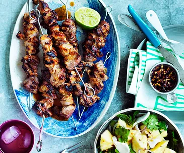 Pork skewers with young coconut and pineapple salad