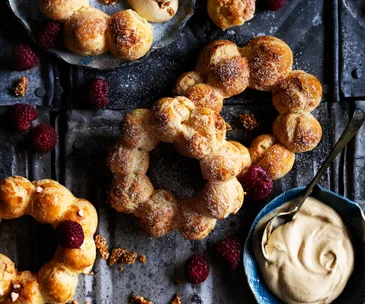 Choux pastry wreaths with a dipping sauce