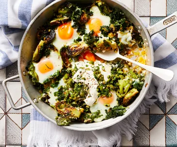 Green shakshuka with Brussels sprouts, olives and labne
