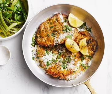Veal cotoletta with asparagus and preserved lemon