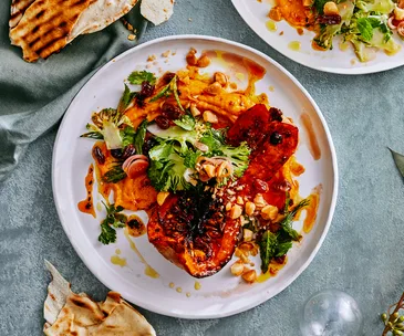Caramelised pumpkin topped with broccoli fatteh and macadamias