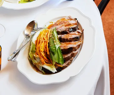 Roast pork neck, sweet and sour sauce, vegetable salad