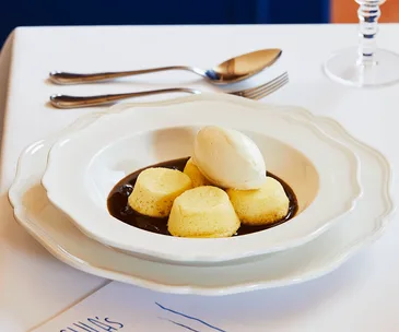 Golden syrup dumplings, rum, raisin and malt cream