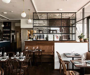 Onzieme Canberra ACT dining room with timber chairs, tables and hanging pendant lights