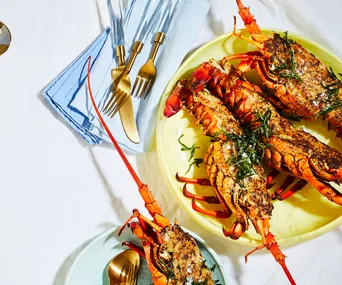 halved-lobsters-on-colourful-plates