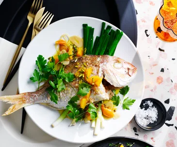 Whole snapper with orange and pistachio sauce