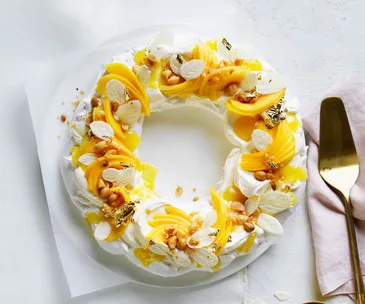 Mango, macadamia and spiced white chocolate pavlova wreath