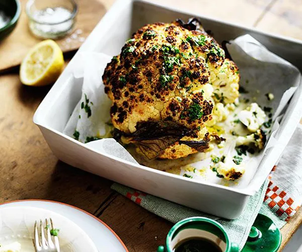 Whole roast cauliflower with parsley and anchovy sauce