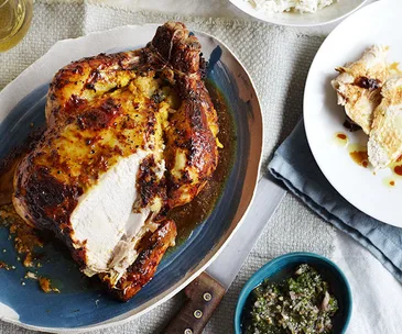 Spiced-yoghurt roast chicken with potato and ginger stuffing