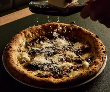  Bandit Pizza and Wine's lamb ragù, pecorino and basil pizza