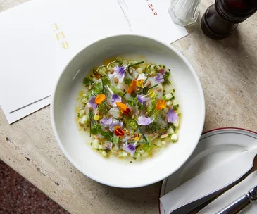 Her Bar in Melbourne, Victoria. Photo of the ceviche decorated with colourful edible flowers.